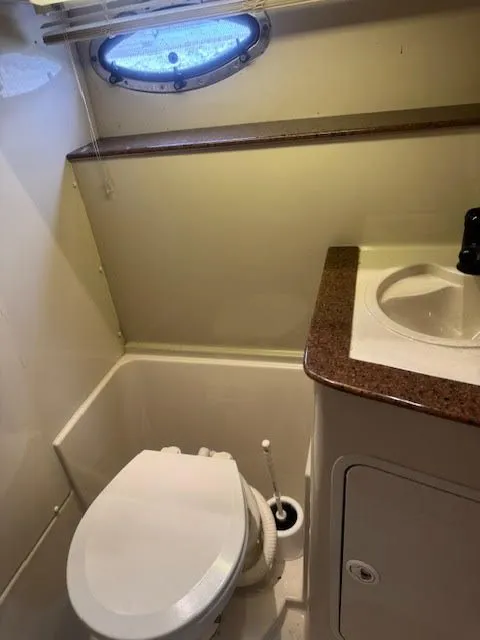Slide: The Image of 1998 Cruisers Yachts 3870 Espirit bathroom with toilet and sink. - 36
