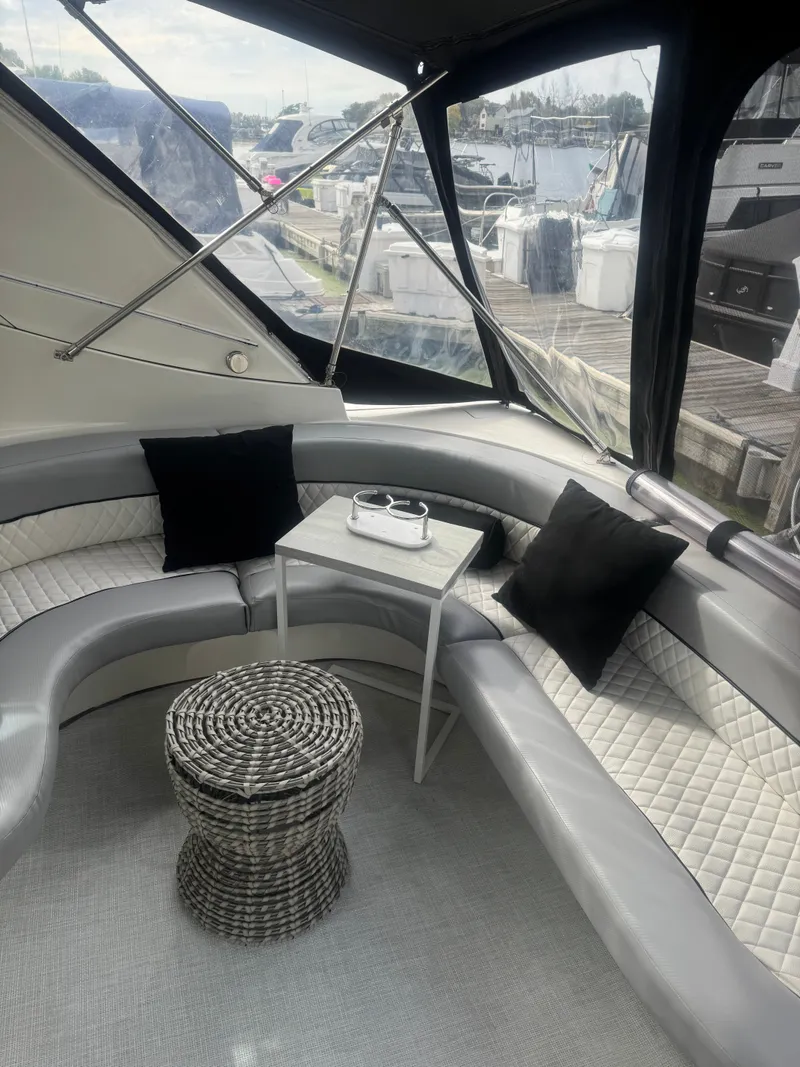 Slide: The Image of Interior of 1998 Cruisers Yachts 3870 Espirit with elegant seating area. - 4