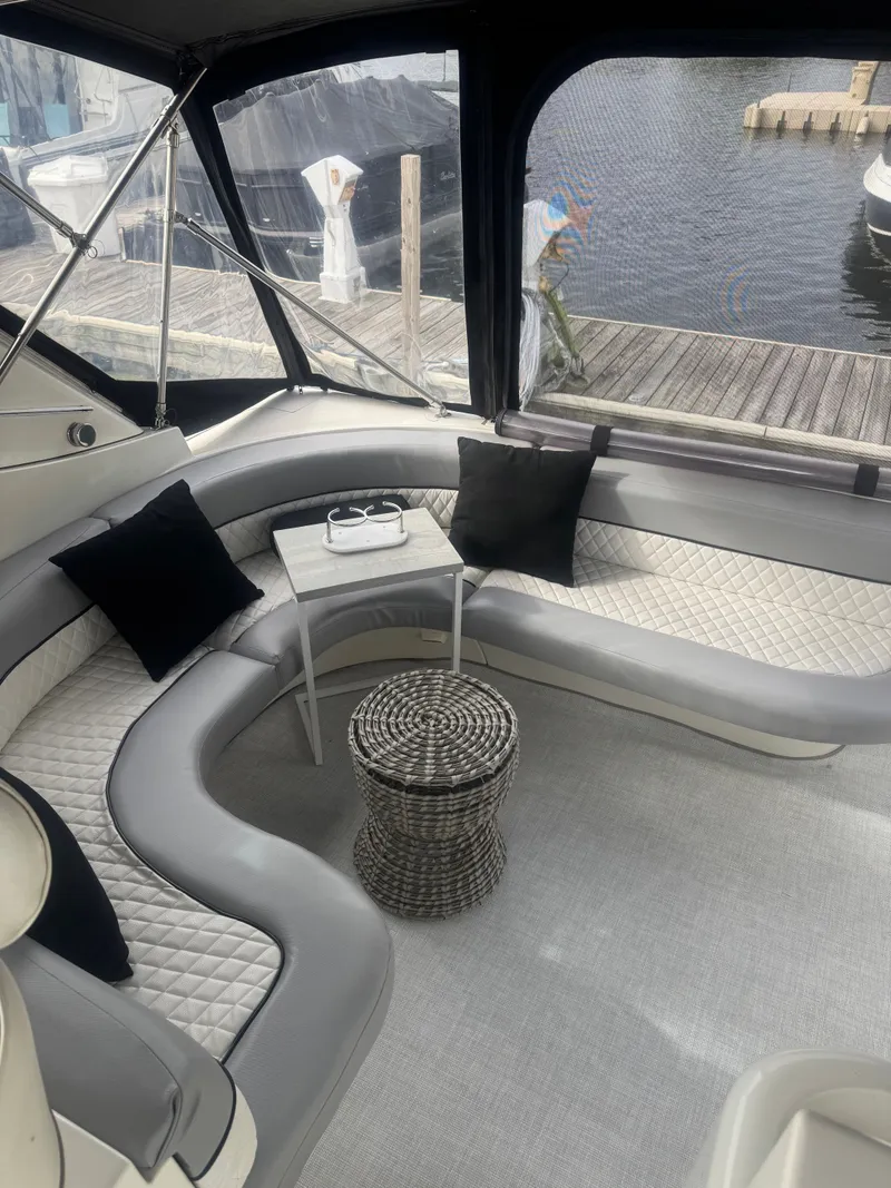 Slide: The Image of Interior of a 1998 Cruisers Yachts 3870 Espirit with gray seating. - 5