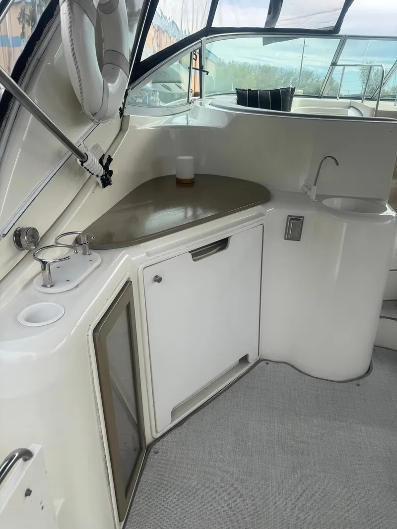 Slide: The Image of Interior of a 1998 Cruisers Yachts 3870 Espirit with sink and storage. - 9