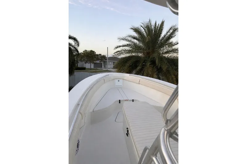 Slide: The Image of 2006 Hydra-Sports Vector 3300 CC boat deck with palm trees in the background. - 15
