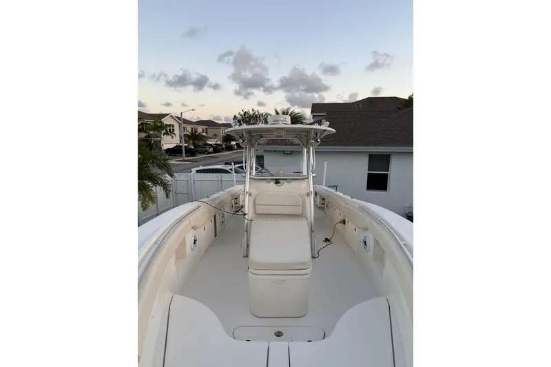 Slide: The Image of 2006 Hydra-Sports Vector 3300 CC boat docked in a residential area at sunset. - 9