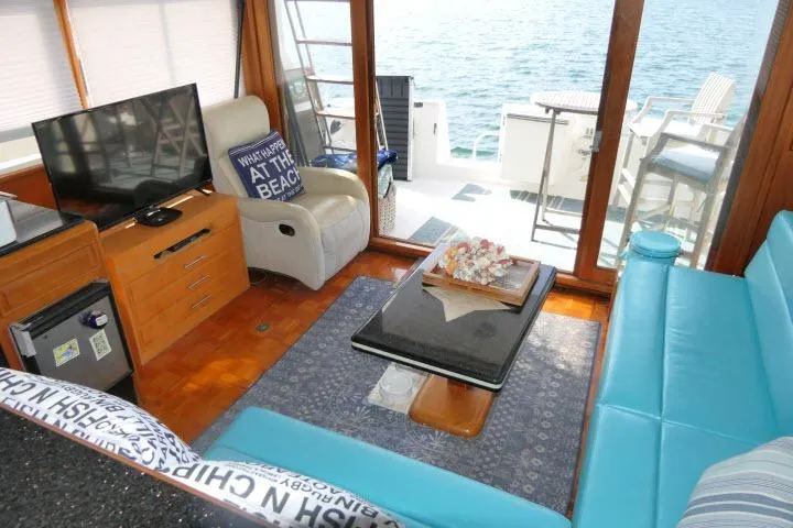 Slide: The Image of Interior of 1986 Ocean Alexander 39 Sedan yacht with modern seating and ocean view. - 14