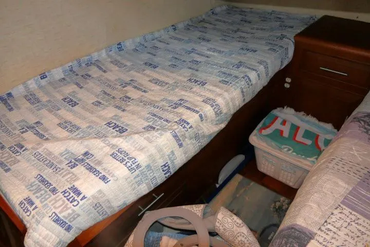 Slide: The Image of Interior cabin of 1986 Ocean Alexander 39 Sedan with nautical-themed bedding. - 24