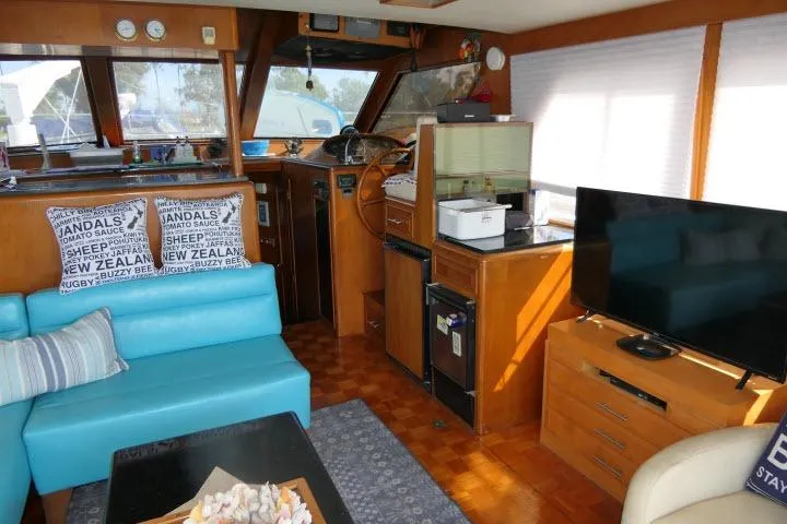 Slide: The Image of Interior of 1986 Ocean Alexander 39 Sedan yacht with cozy seating and modern amenities. - 4