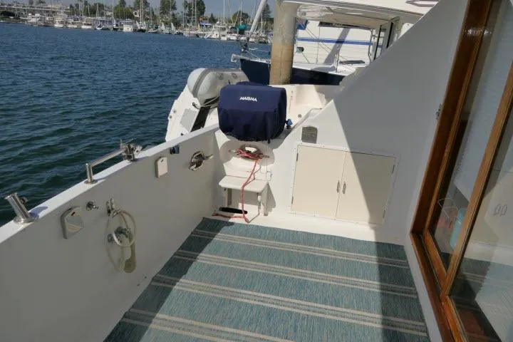Slide: The Image of 1986 Ocean Alexander 39 Sedan yacht deck with marina view. - 42