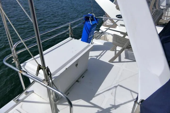 Slide: The Image of 1986 Ocean Alexander 39 Sedan deck with storage box and seating area. - 50