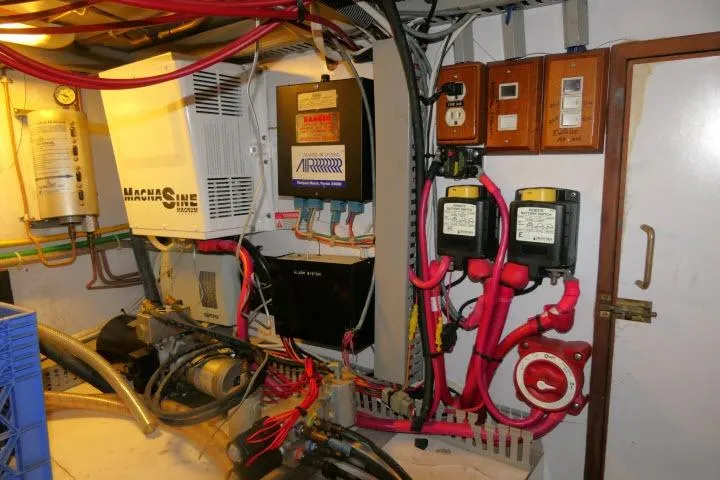 Slide: The Image of Engine room of 1986 Ocean Alexander 39 Sedan with electrical systems and wiring. - 61