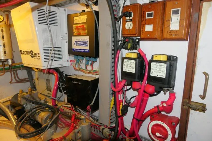 Slide: The Image of Electrical panel of a 1986 Ocean Alexander 39 Sedan with wiring and control systems. - 62