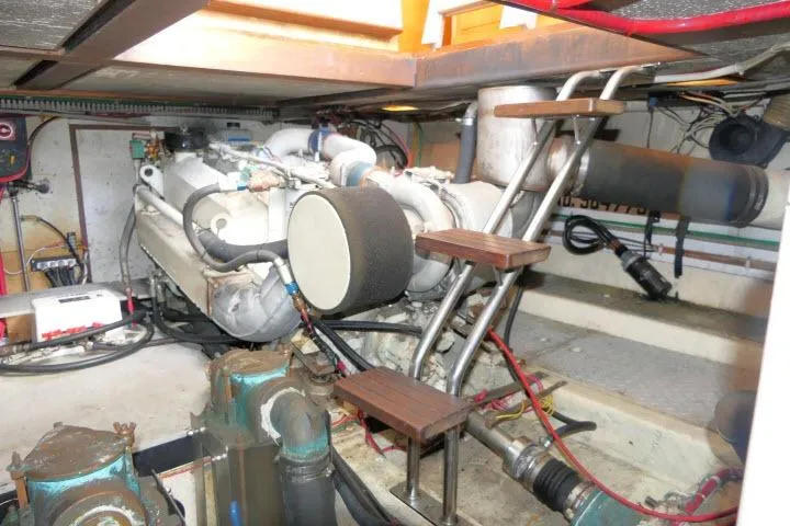 Slide: The Image of Engine room of 1986 Ocean Alexander 39 Sedan with visible machinery and equipment. - 66