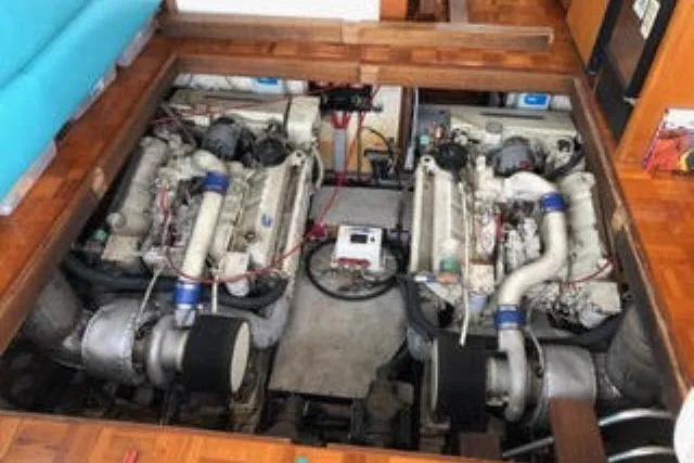Slide: The Image of Engine room of 1986 Ocean Alexander 39 Sedan with dual engines visible. - 68