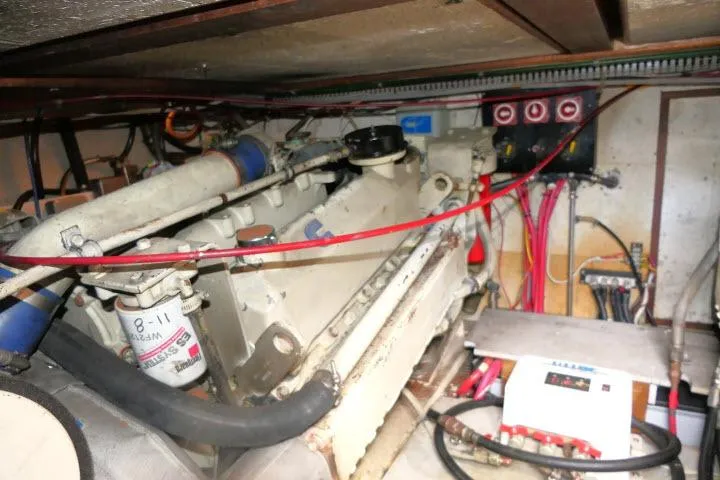 Slide: The Image of Engine room of 1986 Ocean Alexander 39 Sedan with visible wiring and components. - 69