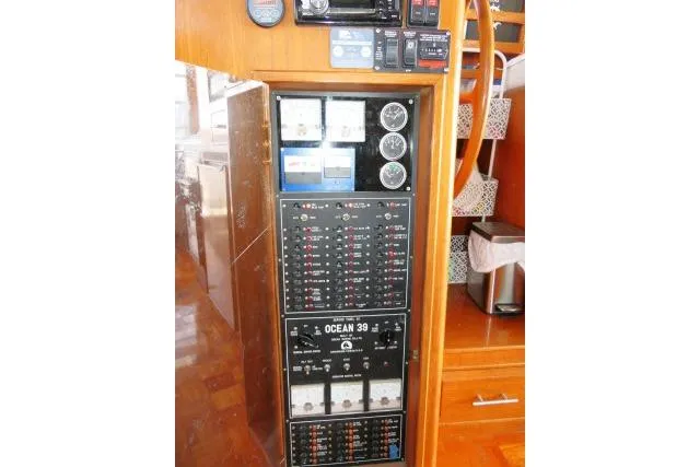 Slide: The Image of Electrical panel of 1986 Ocean Alexander 39 Sedan yacht with gauges and controls. - 7