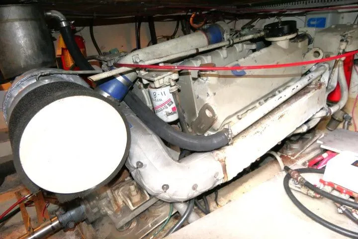 Slide: The Image of Engine compartment of a 1986 Ocean Alexander 39 Sedan yacht, showcasing mechanical components. - 70