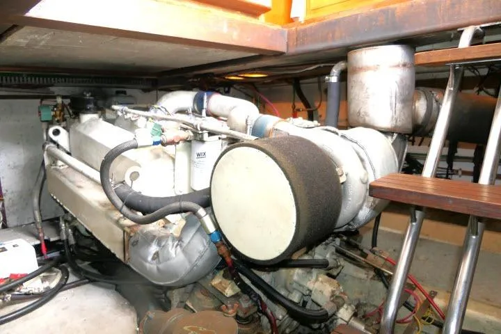 Slide: The Image of Engine room of 1986 Ocean Alexander 39 Sedan yacht, showcasing mechanical components. - 71