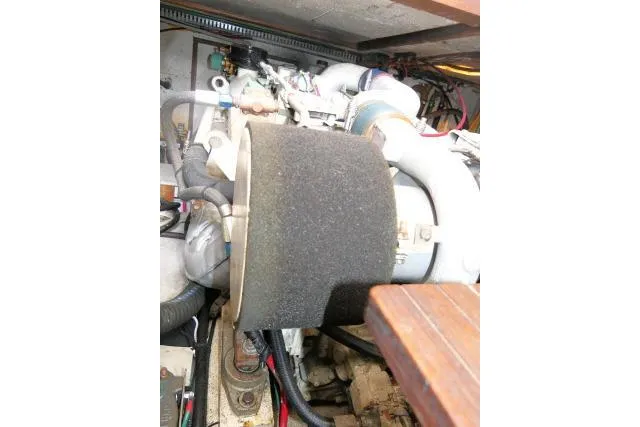 Slide: The Image of Engine compartment of 1986 Ocean Alexander 39 Sedan yacht, showcasing mechanical components. - 72