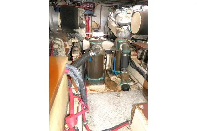 Slide: The Image of Engine room of 1986 Ocean Alexander 39 Sedan with visible machinery and components. - 73