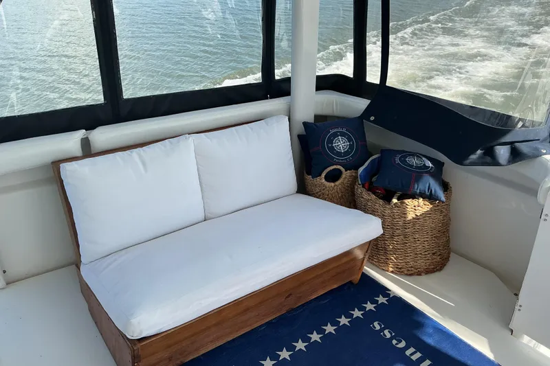 Slide: The Image of Cozy seating area on 1999 Silverton 422 Motor Yacht with ocean view and nautical decor. - 15