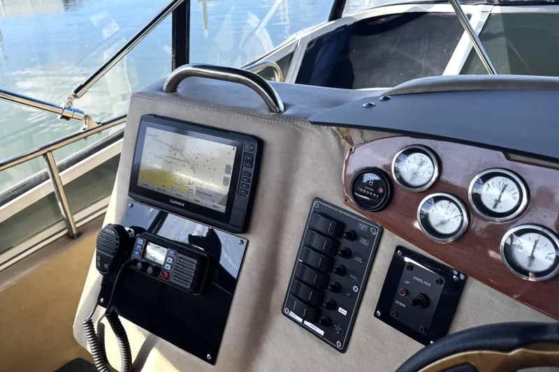 Slide: The Image of 1999 Silverton 422 Motor Yacht dashboard with navigation system and gauges. - 5