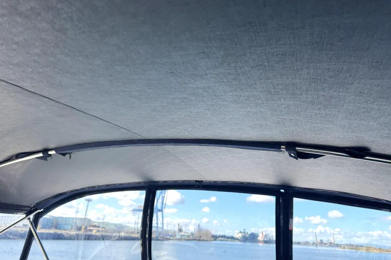 Slide: The Image of Interior view of 1999 Silverton 422 Motor Yacht with water and sky visible through windows. - 9