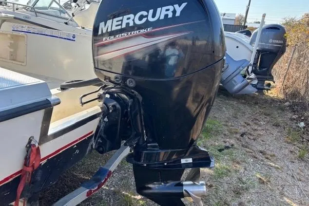 Slide: The Image of Outboard motor on a 1992 Key West 1900 Sportsman boat, featuring Mercury FourStroke engine. - 5