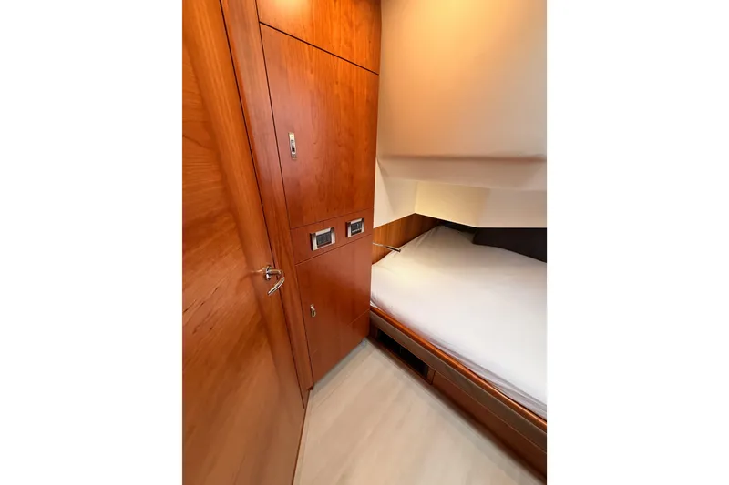 Slide: The Image of Interior cabin of 2016 Moody Decksaloon 54 yacht with wooden finish and cozy bed. - 102