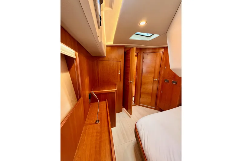 Slide: The Image of Luxurious interior of 2016 Moody Decksaloon 54 yacht with wooden finishes and modern lighting. - 104