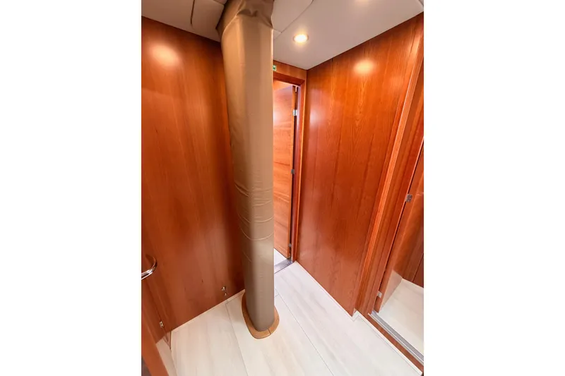 Slide: The Image of Interior of 2016 Moody Decksaloon 54 yacht with wooden walls and column. - 106