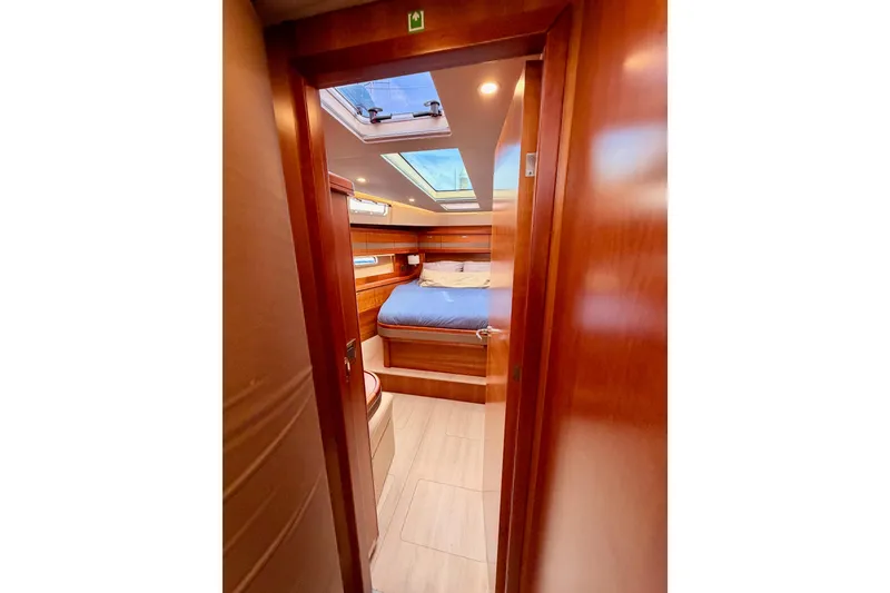 Slide: The Image of Luxurious cabin interior of 2016 Moody Decksaloon 54 yacht with skylight and wooden finish. - 107