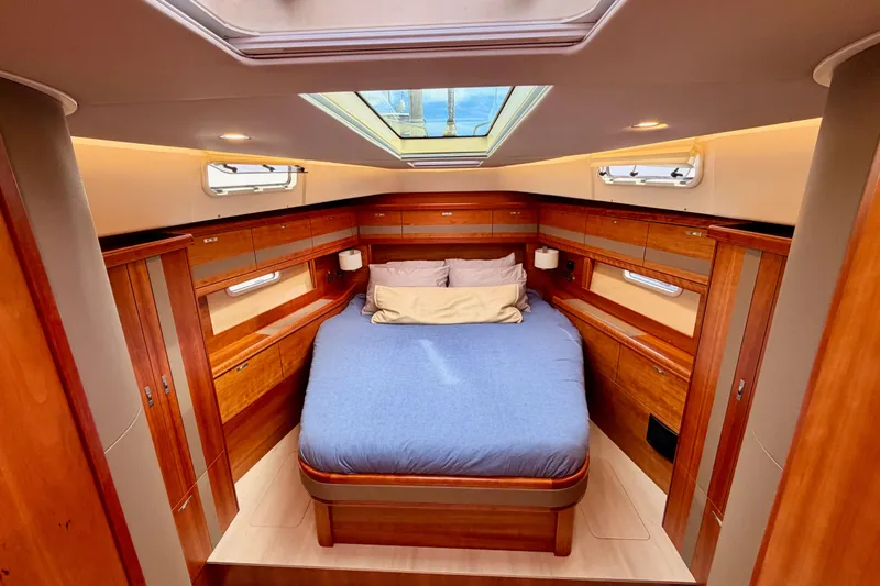 Slide: The Image of Luxurious cabin interior of 2016 Moody Decksaloon 54 yacht with skylight and wood finish. - 109