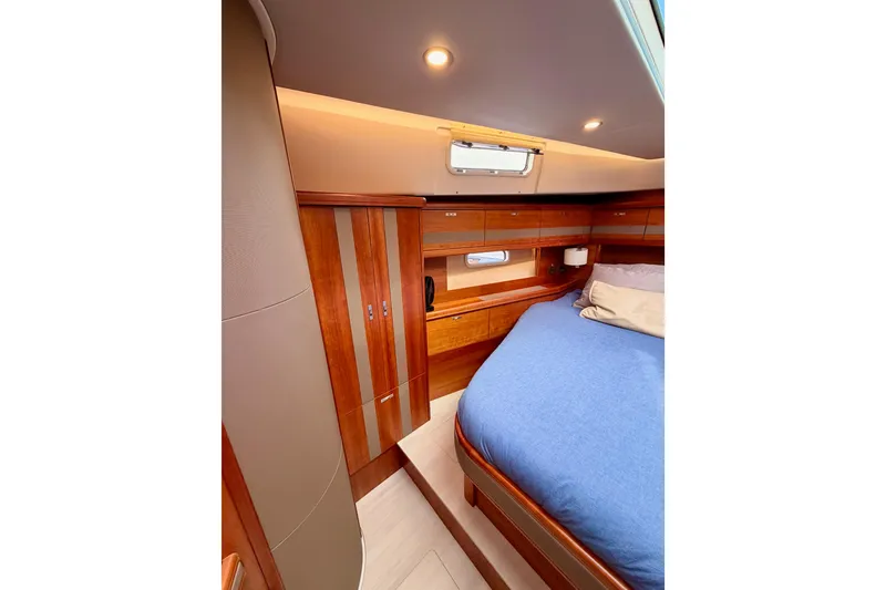 Slide: The Image of Luxurious cabin interior of 2016 Moody Decksaloon 54 yacht with wooden finishes. - 111