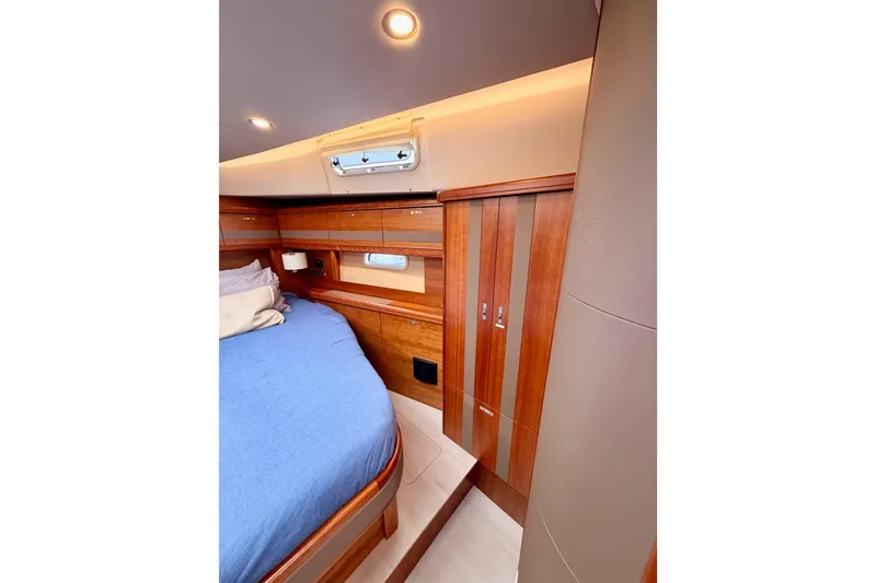 Slide: The Image of Luxurious cabin interior of 2016 Moody Decksaloon 54 yacht with wooden finishes. - 112