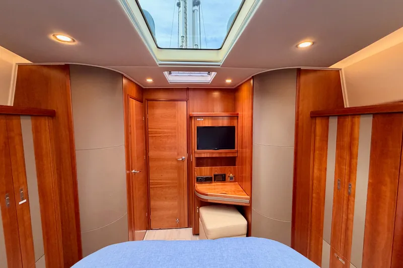 Slide: The Image of Luxurious interior of 2016 Moody Decksaloon 54 yacht with wood finish and skylight. - 113
