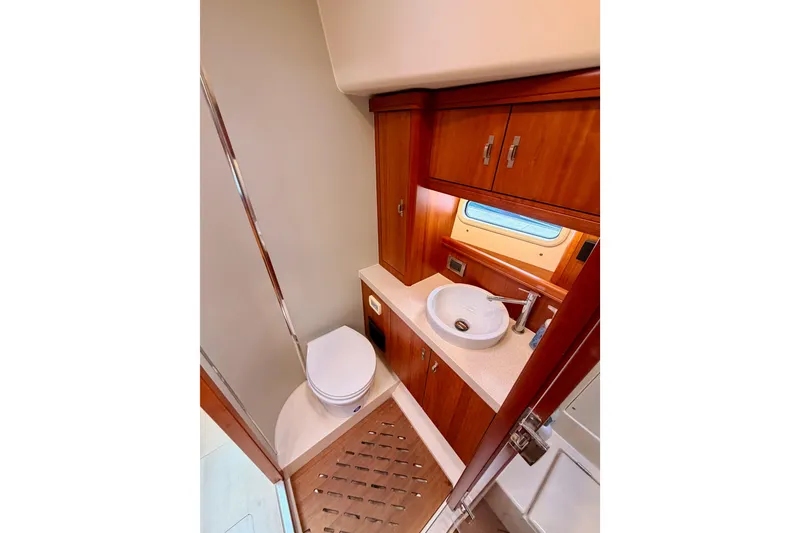 Slide: The Image of Luxurious bathroom in 2016 Moody Decksaloon 54 yacht with wood cabinetry and modern fixtures. - 119