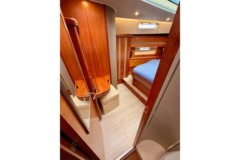 Slide: The Image of Luxurious interior of 2016 Moody Decksaloon 54 yacht with wood finish and cozy bedroom. - 120