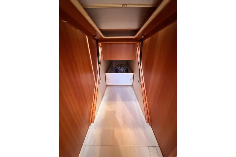 Slide: The Image of Interior hallway of 2016 Moody Decksaloon 54 yacht with wooden paneling. - 122