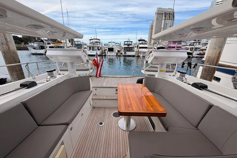 Slide: The Image of Luxurious 2016 Moody Decksaloon 54 yacht interior with elegant seating and wooden table. - 127