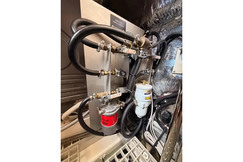 Slide: The Image of Engine room of 2016 Moody Decksaloon 54 yacht with fuel system components. - 137