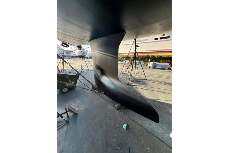 Slide: The Image of Keel of 2016 Moody Decksaloon 54 yacht in dry dock, showcasing sleek design. - 138