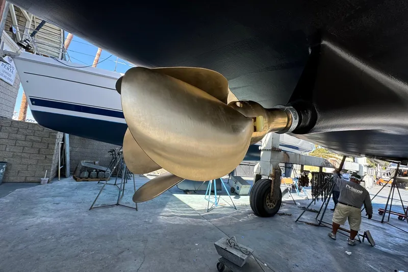 Slide: The Image of Close-up of a 2016 Moody Decksaloon 54 yacht propeller in a shipyard. - 140