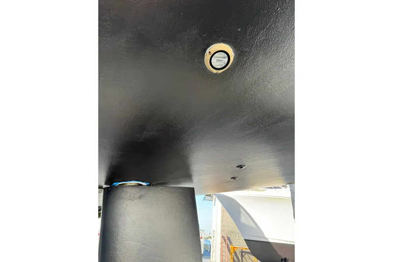 Slide: The Image of Underside view of 2016 Moody Decksaloon 54 yacht hull with visible fittings. - 142