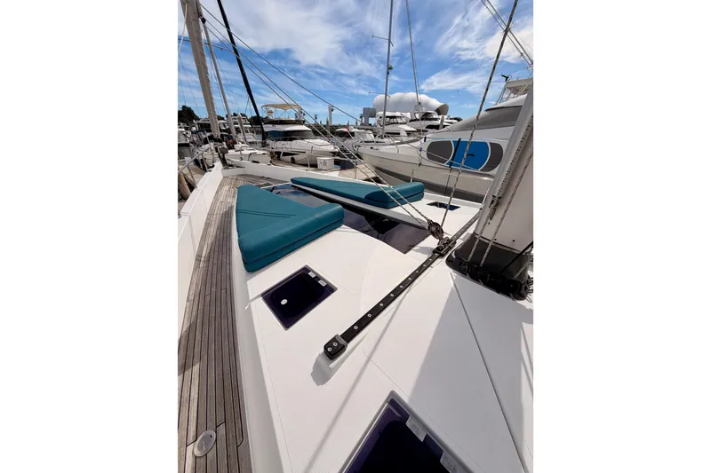 Slide: The Image of Sailing yacht Moody Decksaloon 54, 2016 model, docked with blue cushions on deck. - 19