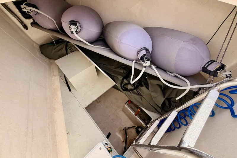 Slide: The Image of Storage compartment of 2016 Moody Decksaloon 54 yacht with fenders and equipment. - 23