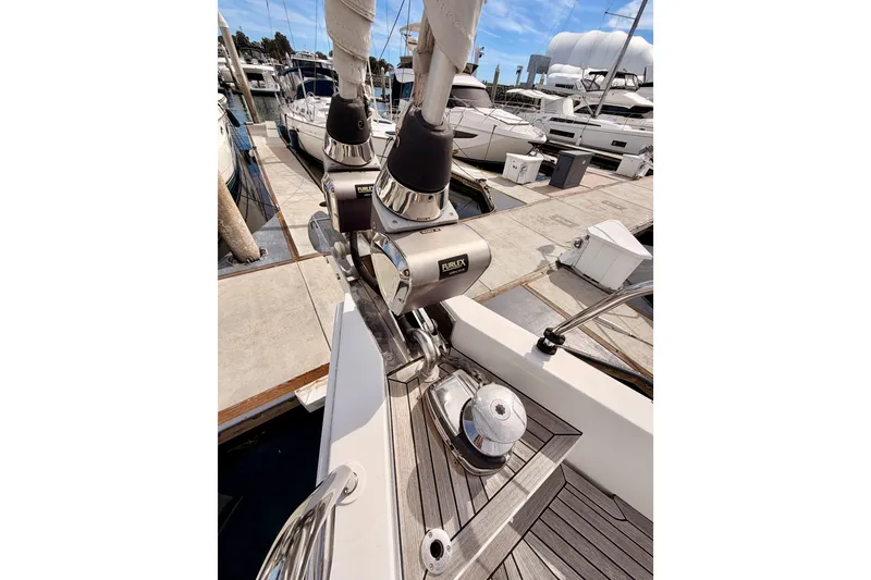 Slide: The Image of Moody Decksaloon 54 yacht, 2016 model, docked with visible furling system and deck details. - 26