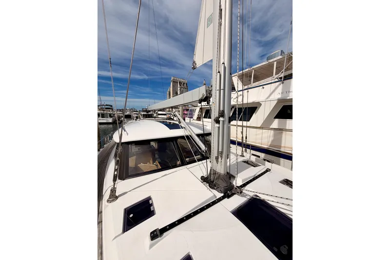 Slide: The Image of 2016 Moody Decksaloon 54 yacht docked, showcasing sleek design and modern rigging. - 30