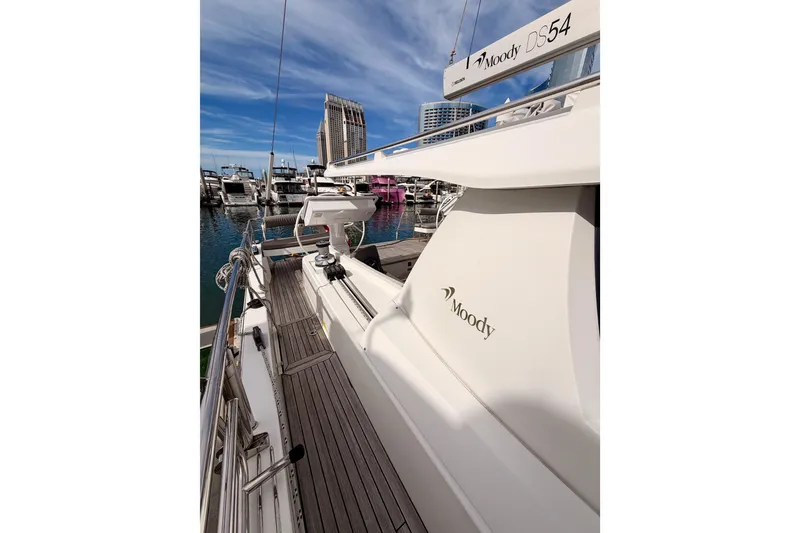 Slide: The Image of 2016 Moody Decksaloon 54 yacht docked at marina, showcasing sleek design and luxury features. - 33