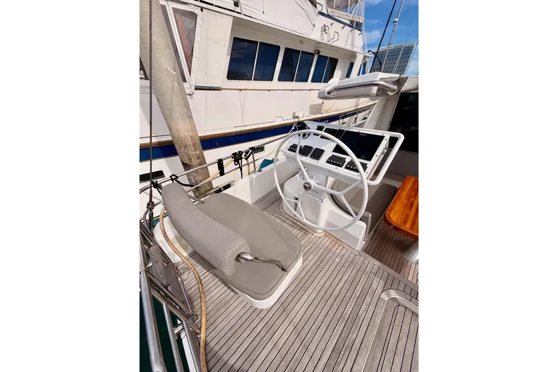 Slide: The Image of Helm of 2016 Moody Decksaloon 54 yacht with wooden deck and steering wheel. - 39