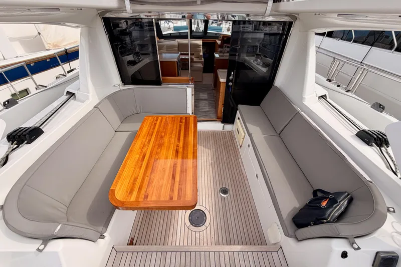 Slide: The Image of Luxurious 2016 Moody Decksaloon 54 yacht interior with elegant seating and wooden table. - 43