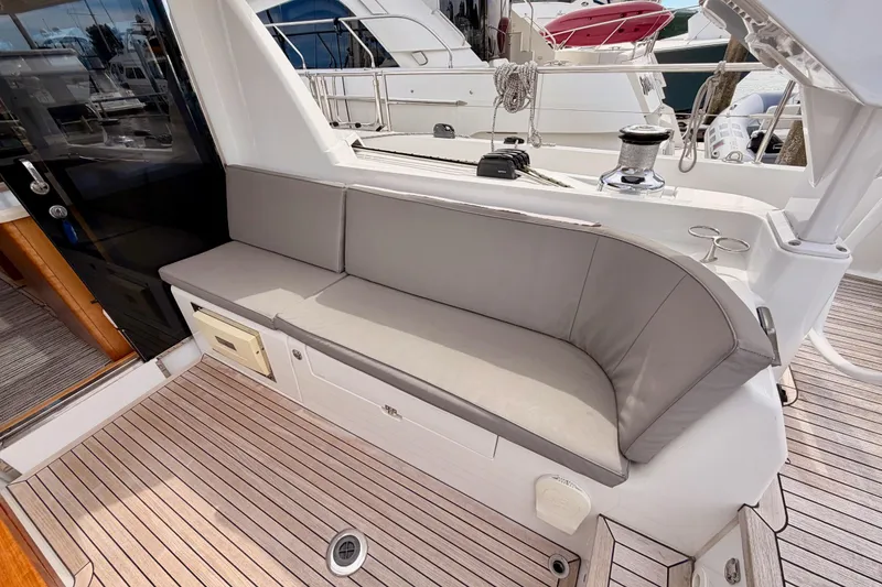 Slide: The Image of Luxurious seating area on 2016 Moody Decksaloon 54 yacht with teak flooring. - 47