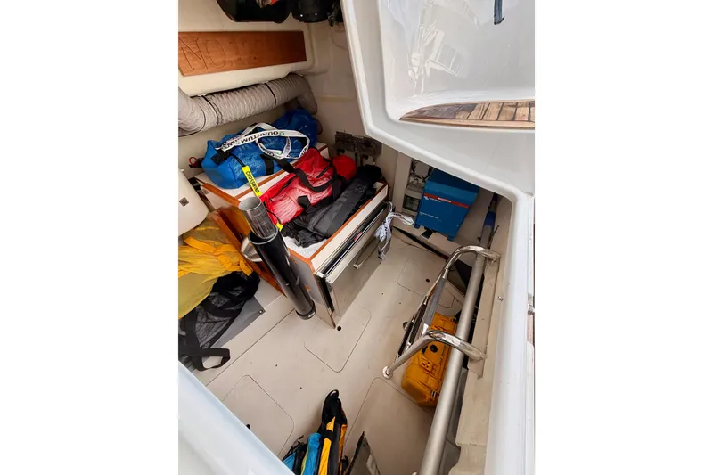 Slide: The Image of Storage compartment of 2016 Moody Decksaloon 54 yacht, filled with equipment and supplies. - 50
